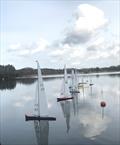 10 Rater Tankard at Frensham - a good lineup at the start, but hardly any movement and wind indicators pointing in different directions, but the efficiency of these boats still provided a good performance when a gust arrived © John Haine