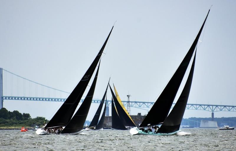 Enterprise (US-27) and Courageous (US-26) chasing the Grand Prix fleet to weather at the 2019 12mR World Championship in Newport, Rhode Island photo copyright SallyAnne Santos taken at  and featuring the 12m class