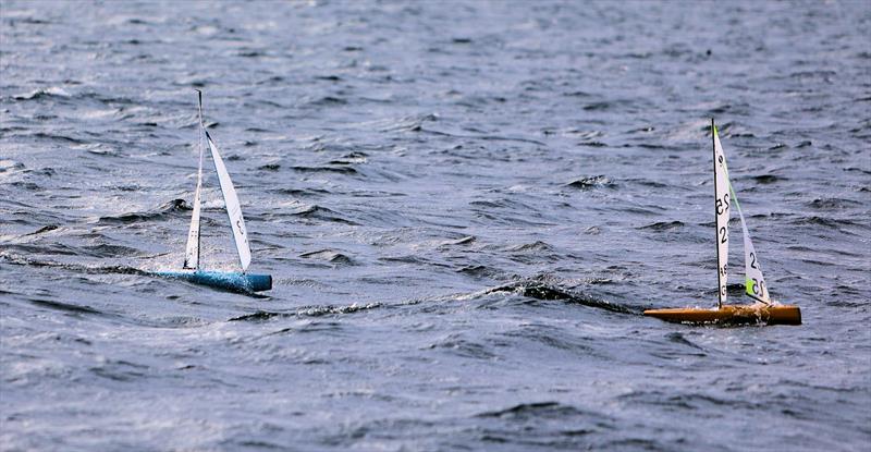 2026 IOM Worlds at Datchet Water Day 3 - Race 11 Heat A FRA 73 surfing down a wave chasing GBR 25 - photo © Mark Jardine