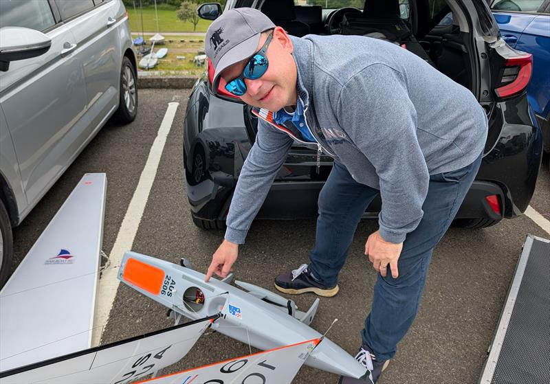 2026 IOM Worlds at Datchet Water Day 4 - Remco Sol points out the repaired area on IOM AUS 106 - photo © Mark Jardine