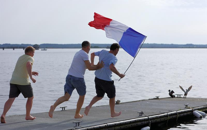 The winners celebrating with a dunk at the 2026 IOM Worlds - Alexis, Zvonko and Rob photo copyright Mark Jardine taken at Datchet Water Sailing Club and featuring the One Metre class