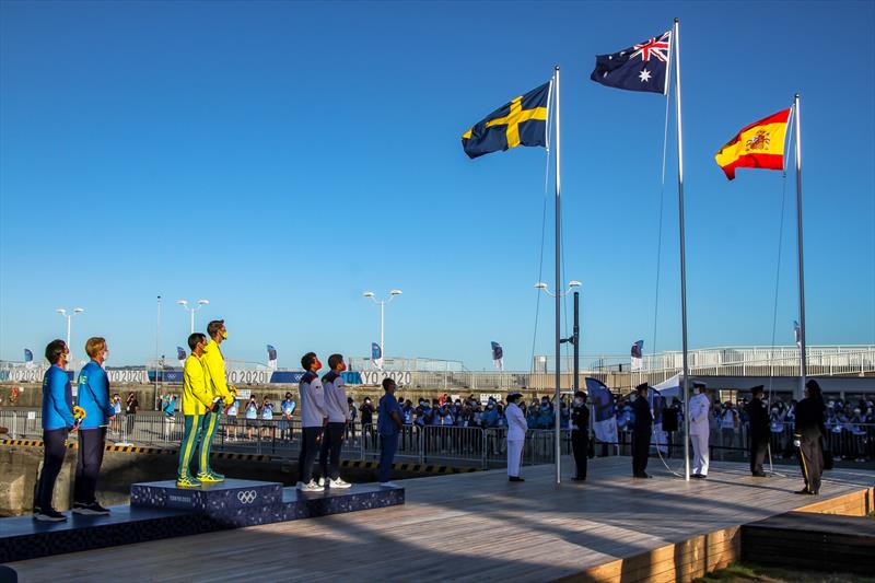 Mat Belcher and Will Ryan whatch as the Australian flag is hoisted at the Medal ceremony for the Mens 470 - Tokyo2020 - Day 10 - August 4,, Enoshima, Japan - photo © Richard Gladwell - Sail-World.com / nz
