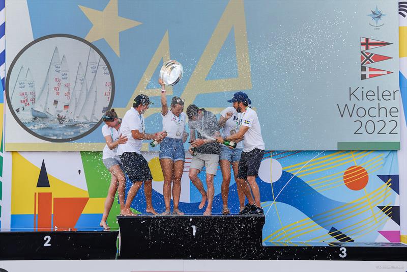 470 podium celebrates at Kiel Week photo copyright ChristianBeeck.de / Kieler Woche taken at Kieler Yacht Club and featuring the 470 class