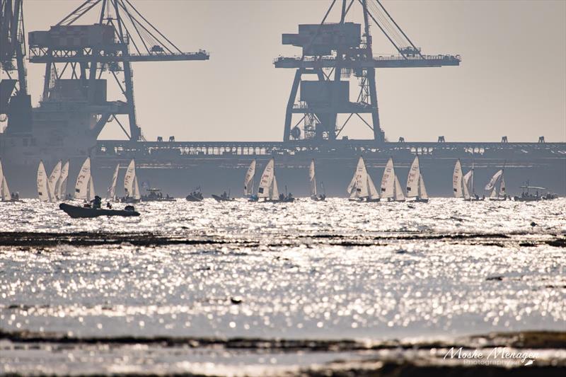 The cranes look on approvingly as 470s cross the finish on 470 Worlds at Sdot Yam, Israel day 5 photo copyright Moshe Menagen / Int. 470 Class taken at Sdot Yam Sailing Club and featuring the 470 class