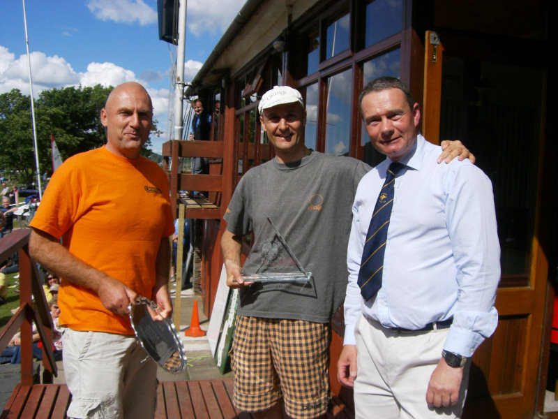 Lester Noble (left) & Lee Noble (centre) after receiving the Lord Birkett Trophy for a record fourth time in a row from UYC Commodore John Robson photo copyright Sue Giles taken at Ullswater Yacht Club and featuring the 49er class