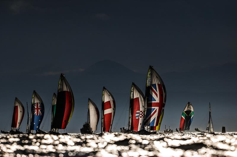 49er fleet under an ominous sky on Tokyo 2020 Olympic Sailing Competition Day 3 photo copyright Sailing Energy / World Sailing taken at  and featuring the 49er class