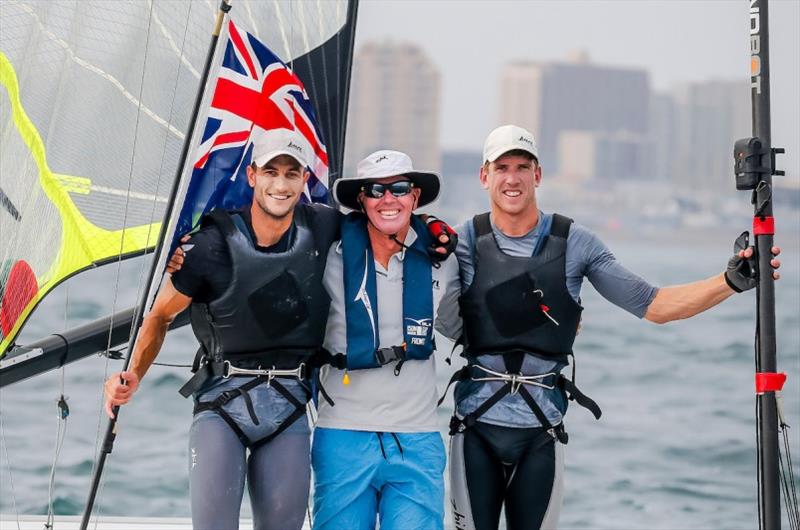 Blair Tuke (L) and Peter Burling (R) celebrate with Coach Hamish Wilcox photo copyright Jesus Renedo / Sailing Energy / World Sailing taken at  and featuring the 49er class