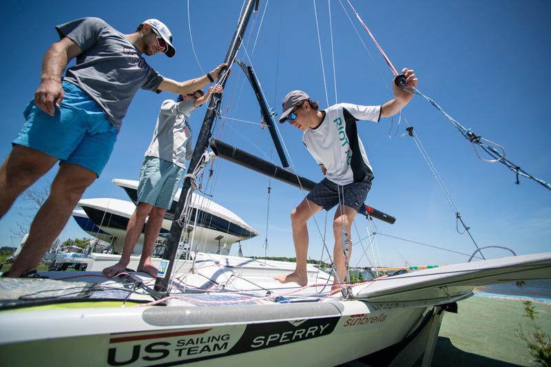 Trainees worked with coach Nate Housberg on rigging a 49er - photo © Lexi Pline