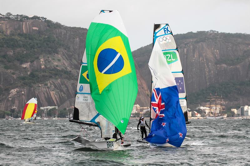 The Gold and Silver medals are decided at the finish of the 49erFX Medal Race - Martine Grael and Kahena Kunze hold a narrow lead on the final metres to the finish line, with Molly Meech and Alex Maloney just behind - Medal Race - 49er FX - Rio 2016 photo copyright Richard Gladwell  taken at Iate Clube do Rio de Janeiro and featuring the 49er FX class