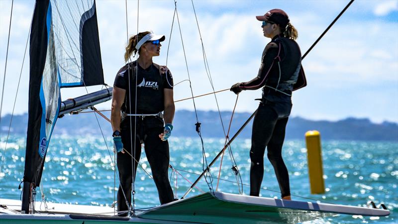 Olympic Silver medalist, Molly Meech has a quick post-race debrief with Olympic Gold and Silver Medalist, Jo Aleh - 49erFX Oceanbridge NZL Sailing Regatta - Takapuna BC February 18, 2022 photo copyright Richard Gladwell / Sail-World.com / nz taken at Takapuna Boating Club and featuring the 49er FX class