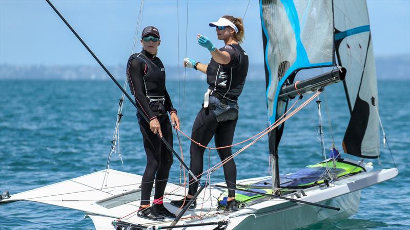 Jo Aleh (left) and Molly Meech between races - Oceanbridge NZL Sailing Regatta - Day 4 - Takapuna BC February 20, photo copyright Richard Gladwell / Sail-World.com / nz taken at Takapuna Boating Club and featuring the 49er FX class