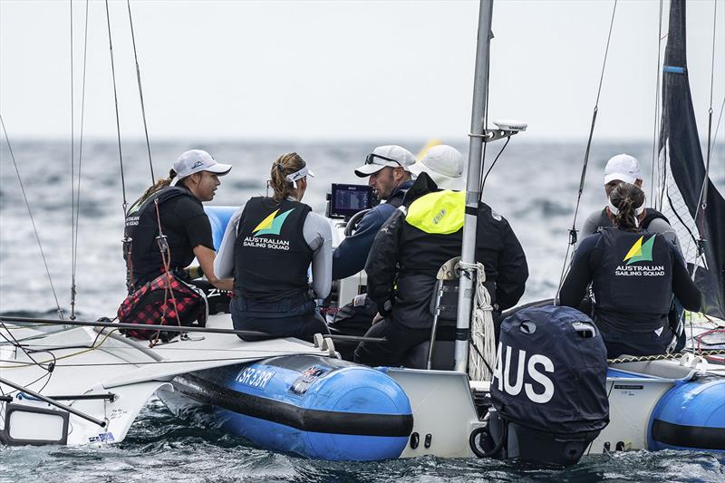 49erFX coaches talk strategy between races photo copyright Beau Outteridge taken at Hubbards Sailing Club and featuring the 49er FX class