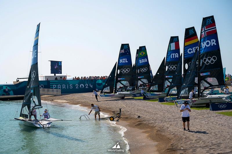 The 49erFX fleet wait for the wind  - Marseille - Paris2024 Olympic Regatta - August 1, 2024 photo copyright World Sailing / Jean-Louis Carli taken at  and featuring the 49er FX class