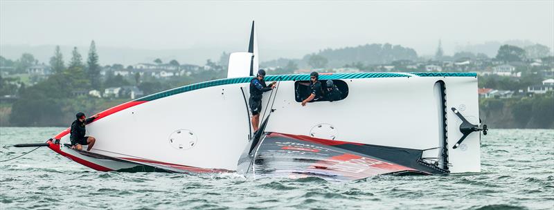 Emirates Team New Zealand - AC40 - OD capsize after striking a UFO - Hauraki Gulf - February 3, 2023 photo copyright Adam Mustill / America's Cup taken at Royal New Zealand Yacht Squadron and featuring the AC40 class
