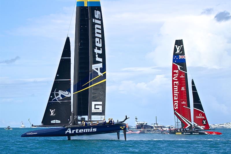 Artemis Racing heads for the finish line passing an already finished Emirates Team New Zealand - Race 7 - Finals, America's Cup Playoffs- Day 15, June 12, 2017 (ADT) photo copyright Richard Gladwell taken at  and featuring the AC50 class