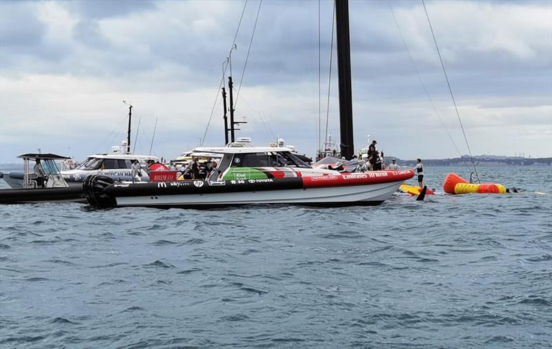 The America's Cup support teams work together to save NYYC American Magic's Patriot after a huge capsize on day 3 of the PRADA Cup photo copyright Richard Gladwell / Sail-World.com taken at  and featuring the AC75 class