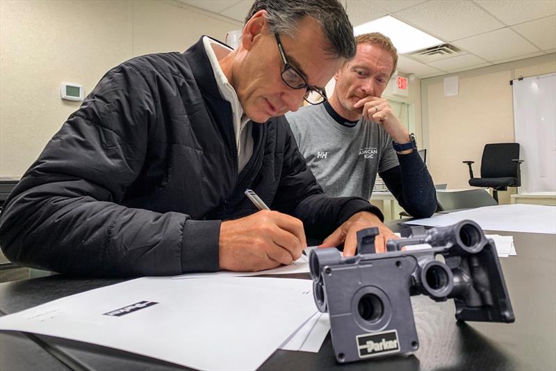 Craig Maxwell (at left), Vice President and Chief Technology and Innovation Officer for Parker Hannifin and Dimitri Despierres of American Magic's Design Team working at the team's production facility in Bristol, Rhode Island. - photo © Will Ricketson