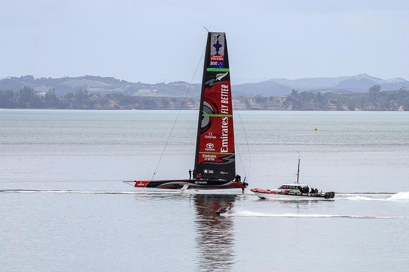 Emirates Team New Zealand under tow in glassy water- chasing the wind  further out in the harbour - September 19, 2019 photo copyright Richard Gladwell taken at Royal New Zealand Yacht Squadron and featuring the AC75 class