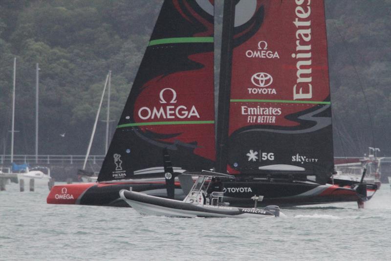 Spy boat gets a good view of Emirates Team NZ's AC75 Te Aihe about to lift clear of the water - December 16, 2019 photo copyright Richard Gladwell / Sail-World.com taken at Royal New Zealand Yacht Squadron and featuring the AC75 class