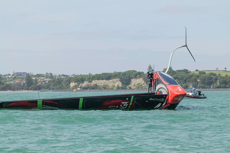 Emirates Team New Zealand in the early stages of being righted with the towline under tension over a chafe pad on the gunnel - Waitemata Harbour - December 19, 2019 photo copyright Emirates Team New Zealand taken at Royal New Zealand Yacht Squadron and featuring the AC75 class