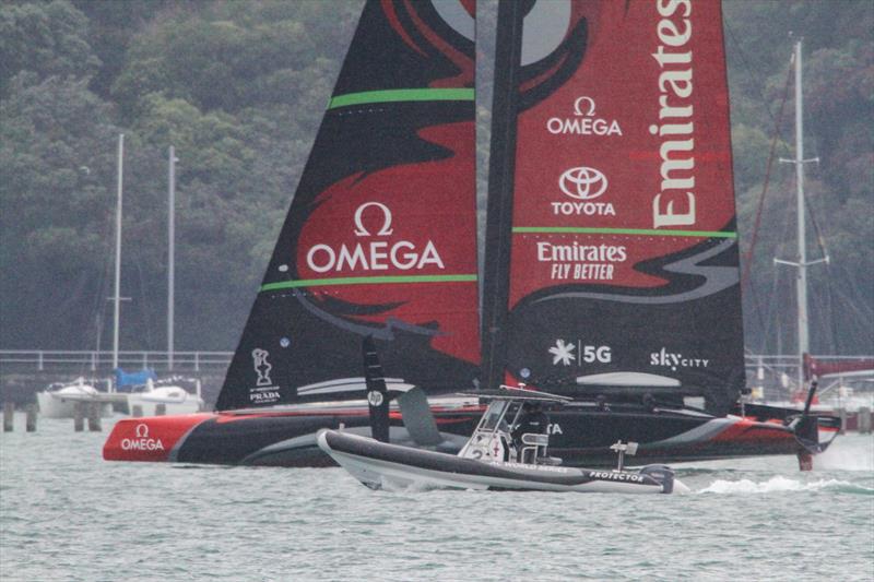 5. Spy boat blocks view as Te Aihe's transom appears well clear of the water reducing stern section drag  - Phases of Foiling - December 2019 photo copyright Richard Gladwell / Sail-World.com taken at Royal New Zealand Yacht Squadron and featuring the AC75 class