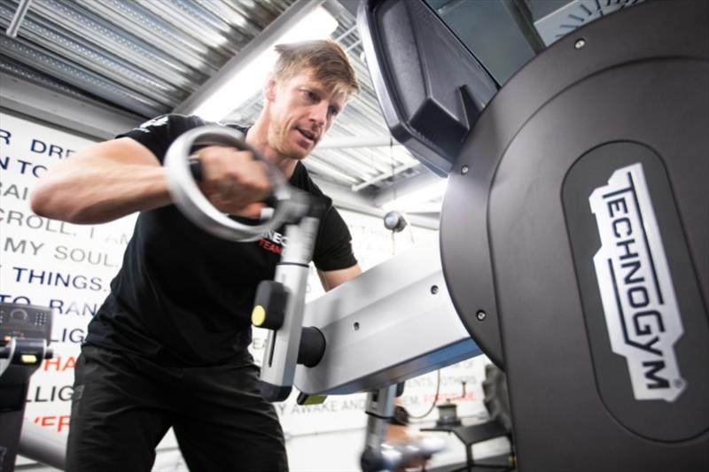 Graeme Spence spinning handles on the land based grinding machine photo copyright Harry KH / INEOS TEAM UK taken at  and featuring the AC75 class