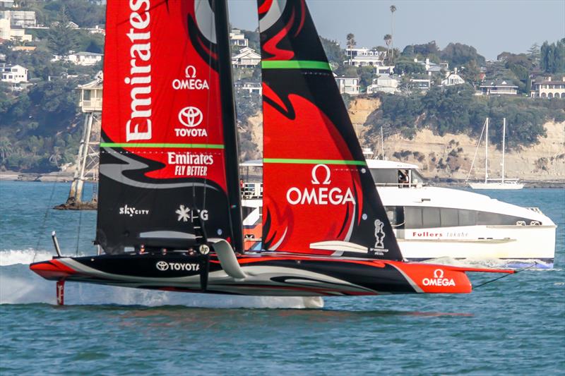 Emirates Team NZ's AC75 Te Aihe races past a fast ferry on her final day on the Waitemata Harbour - January 2020 - Auckland photo copyright Richard Gladwell / Sail-World.com taken at Royal New Zealand Yacht Squadron and featuring the AC75 class