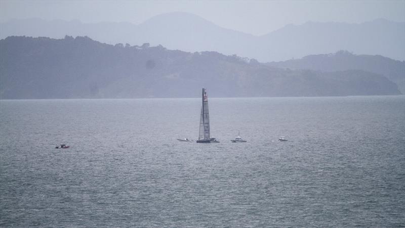 The delights of training in Auckland during the winter. Defiant midway between the mainland and Waiheke with Coromandel in the gloom beyond, photo copyright Richard Gladwell / Sail-World.com taken at New York Yacht Club and featuring the AC75 class