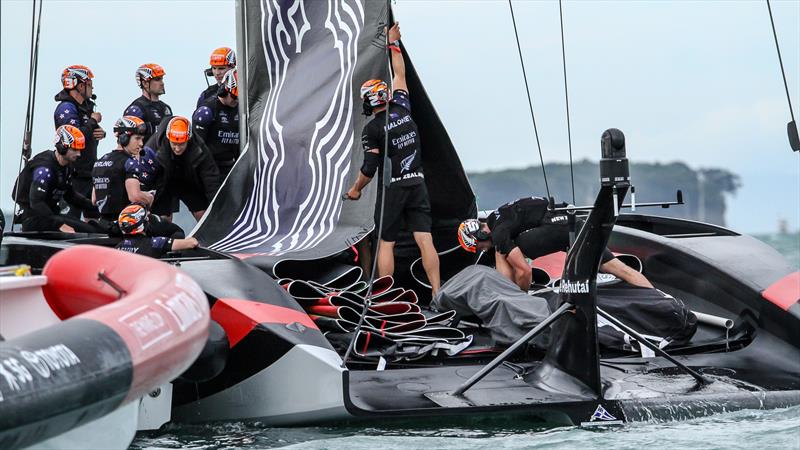 Emirates Team NZ flake their double skinned mainsail - America's Cup - Day 1 - March 10, 2021, Course E photo copyright Richard Gladwell / Sail-World.com taken at Royal New Zealand Yacht Squadron and featuring the AC75 class