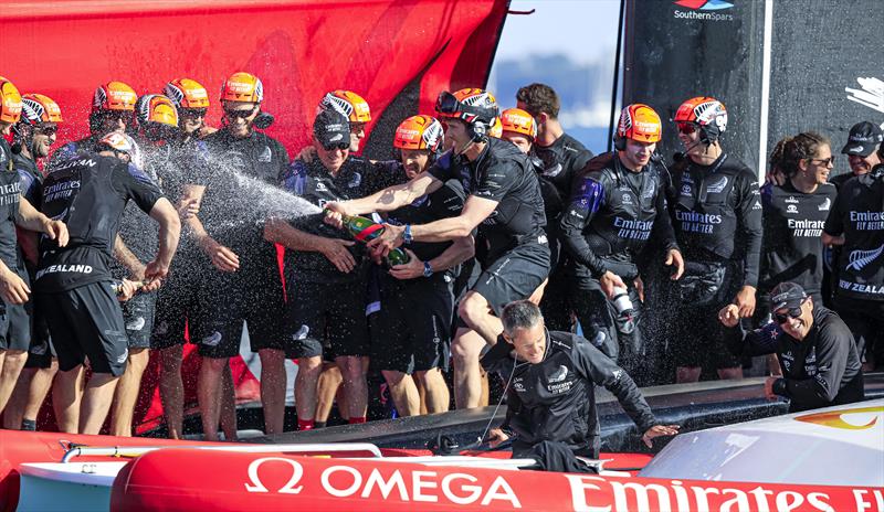 Skipper Peter Burling gives the Emirates Team NZ crew a victory spray just after the final race in the 36th America's Cup. photo copyright ACE / Studio Borlenghi taken at Royal New Zealand Yacht Squadron and featuring the AC75 class