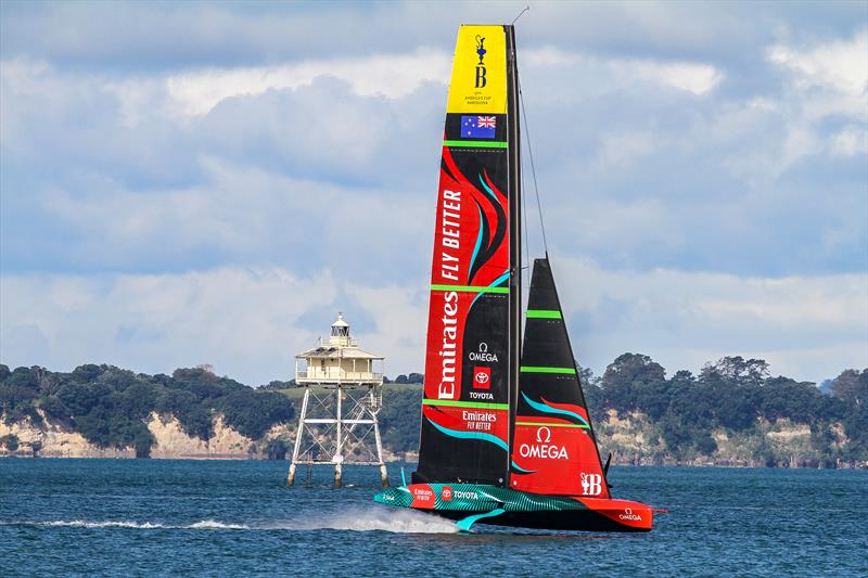 Emirates Team New Zealand pass the iconic Bean Rock lighthouse at the entrance to the inner Waitemata Harbour - March 28, 2023 photo copyright Richard Gladwell - Sail-World.com/nz taken at Royal New Zealand Yacht Squadron and featuring the AC75 class