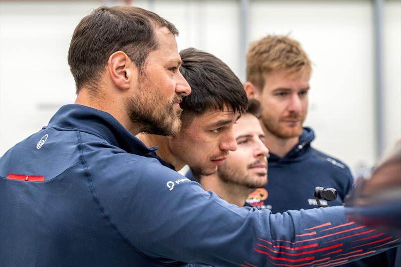 Nico Stahlberg, Franco Noti, Maxim Bachelin and Barnabe Delarze take a first look at AC75 Boat One as she arrives at Alinghi Red Bull Racing base in Barcelona, Spain _ March 4, 2024 photo copyright Olaf Pignataro/Red Bull Content Pool taken at Société Nautique de Genève and featuring the AC75 class