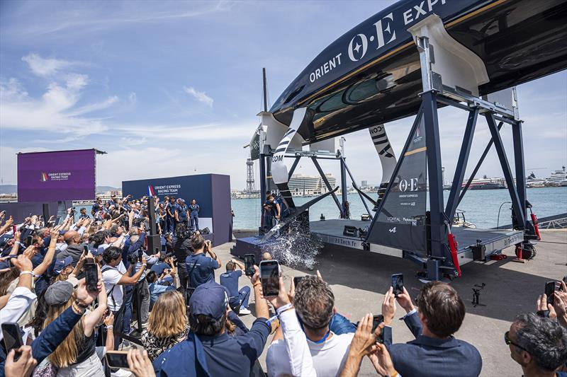 Orient Express Racing Team christen their AC75 race boat - photo © Pau Venteo / Orient Express Racing Team