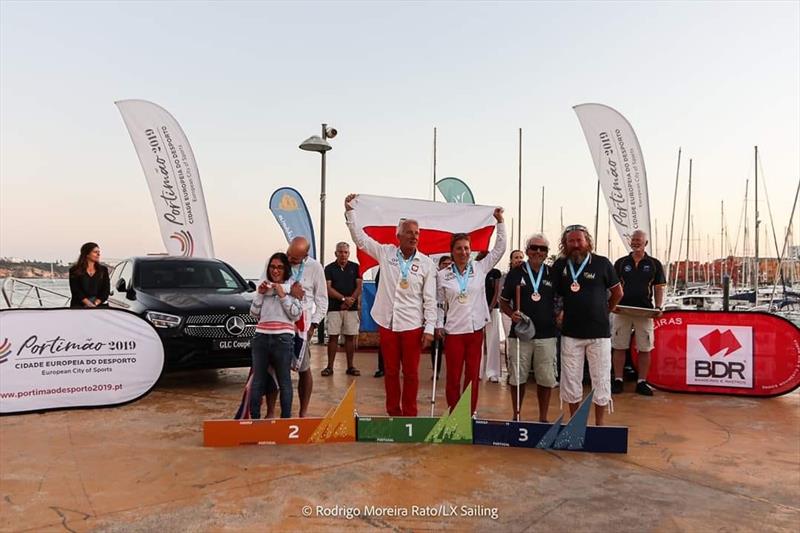 Natalie and Alan in the 303 prize giving during the Hansa Europeans at Portimão, Portugal - photo © Rodrigo Moreira Rato / LX Sailing