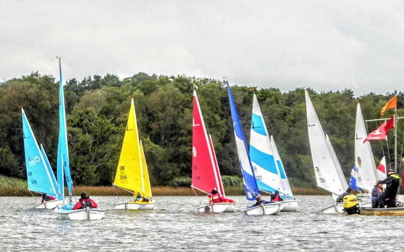 A busy 303 1 Person Fleet race start during the Hansa TT at Frensham photo copyright Tony Machen taken at Frensham Pond Sailing Club and featuring the Hansa class