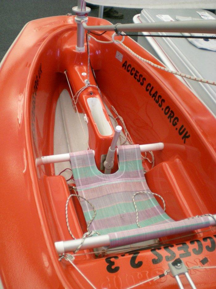 This small Access dinghy has a simple seat and is steered by a central upright lever photo copyright Magnus Smith / www.yachtsandyachting.com taken at RYA Dinghy Show and featuring the Hansa class
