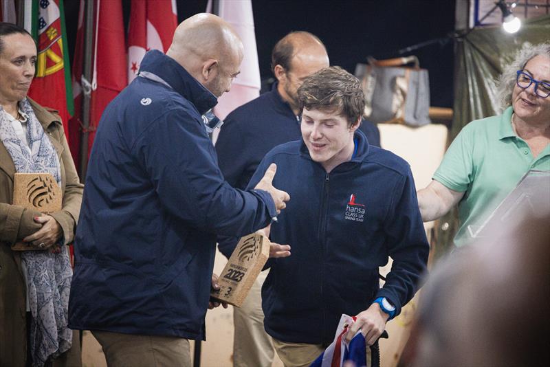 Hansa World Championships at Portimão, Portugal - Rory McKinna collecting his prize for 3rd Hansa 303 - one-person - Clyde Cruising Club photo copyright @portimaochampionships23 taken at  and featuring the Hansa class