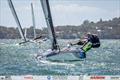 Australian A-Cat Nationals on Lake Macquarie Day 5 - Dom Tanner demonstrates his flexibility on his lovely blue DNA F1x © Gordon Upton / www.guppypix.com