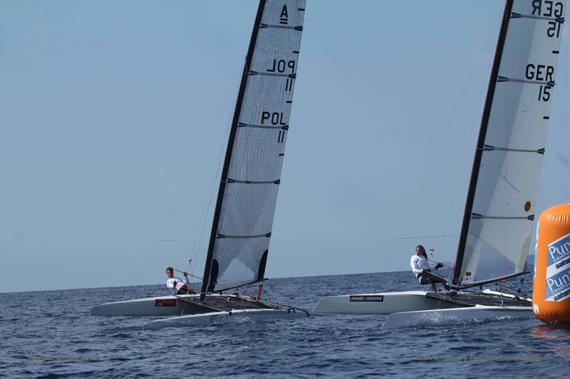 Marcin Badzio leads Katrin Brunner at the top mark on the final day of the A Class Cat Worlds at Punta Ala - photo © Gordon Upton