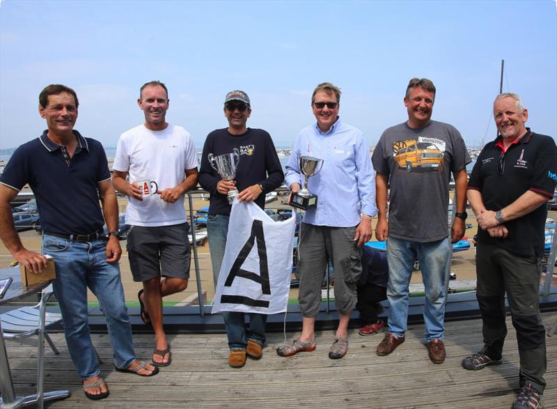A Class Cat UK Nationals at the WPNSA (l-r) Foiling Division: 3rd Dave Roberts, 2nd Paul Larsen, 1st Adam May - Classic Division: 1st Struan Wallace, 2nd Owen Cox, 3rd Gordon Upton - photo © Helena Darvelid / www.sailrocket.com