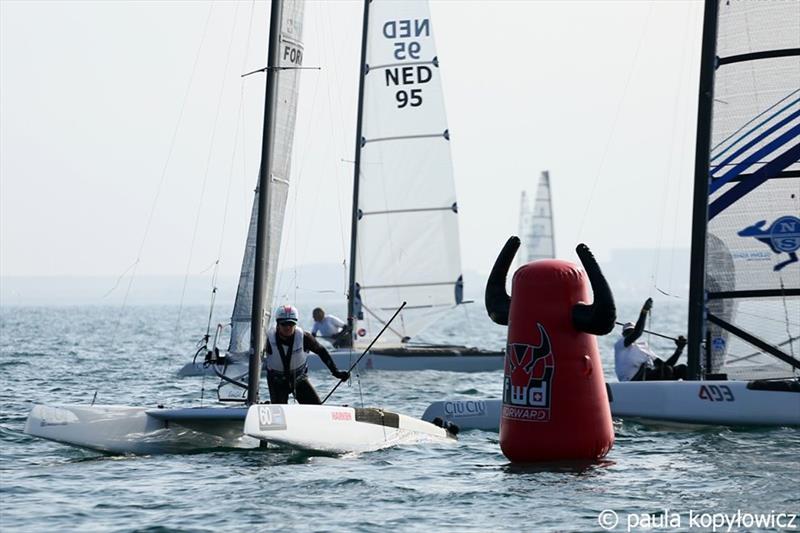 Former multiple World Champion, Stevie Brewin, rounding the bottom mark on day 1 of the A Class Cat Worlds at the WPNSA photo copyright Paula Kopylowicz taken at Weymouth & Portland Sailing Academy and featuring the A Class Catamaran class