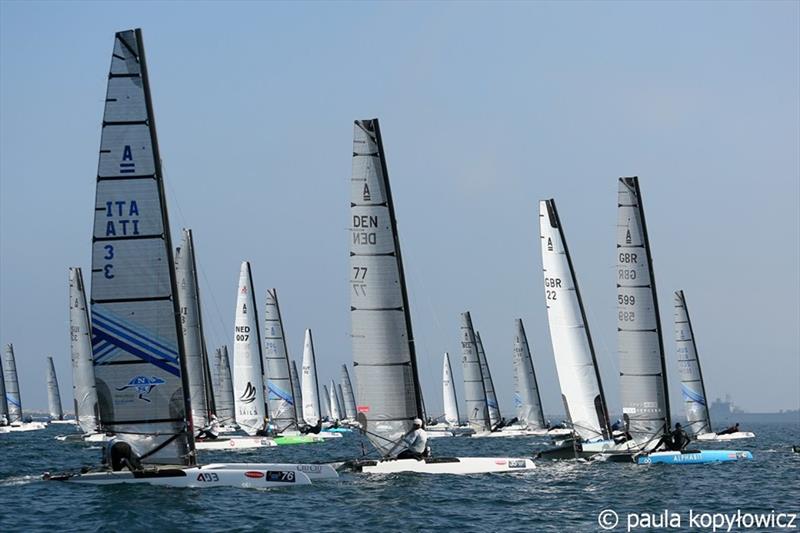 Open Division fleet start on day 1 of the A Class Cat Worlds at the WPNSA photo copyright Paula Kopylowicz taken at Weymouth & Portland Sailing Academy and featuring the A Class Catamaran class