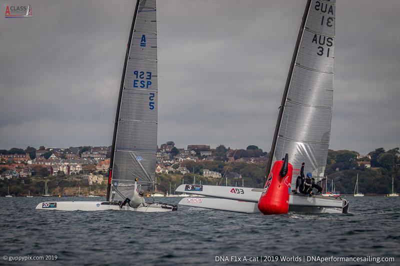 Olympic and former class World Champion Scott Anderson AUS 31, and Enrique Cornejo reach the top mark on lap 1 race 1 of the Classics on day 4 of the A Class Cat Worlds at the WPNSA photo copyright Gordon Upton / www.guppypix.com taken at Weymouth & Portland Sailing Academy and featuring the A Class Catamaran class