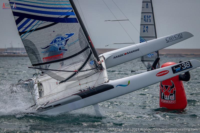 Emmanuel Dode FRA gets rather too much airplay at the bottom mark on day 4 of the A Class Cat Worlds at the WPNSA photo copyright Gordon Upton / www.guppypix.com taken at Weymouth & Portland Sailing Academy and featuring the A Class Catamaran class