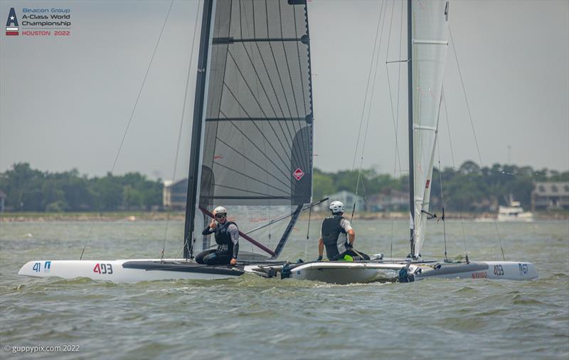 Comrades in arms. Kuba Surowiec congratulating a magnanimous Ravi Parent on his title, moments after the 1 point final race decider at the Beacon Group A-Class Catamaran World Championships in Texas photo copyright Gordon Upton / www.guppypix.com taken at Houston Yacht Club and featuring the A Class Catamaran class