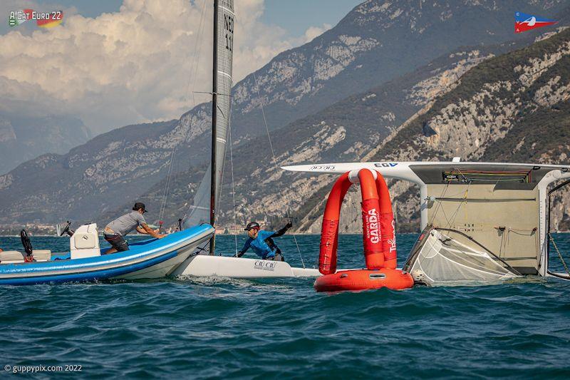 Spreader carnage in action - A-Class European Championships day 4 photo copyright Gordon Upton / www.guppypix.com taken at Circolo Vela Arco and featuring the A Class Catamaran class