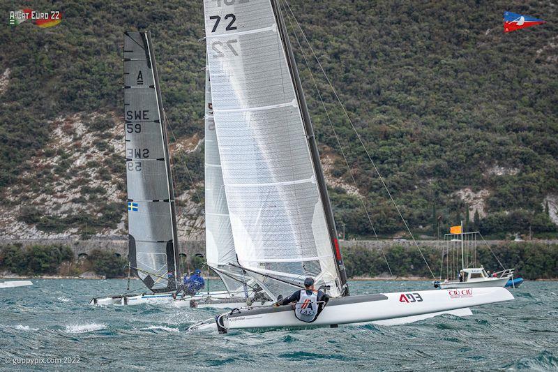 The Classics get away in their first race (wind 19kts, the upper limit for the class is 22kts) - A-Class European Championships day 4 photo copyright Gordon Upton / www.guppypix.com taken at Circolo Vela Arco and featuring the A Class Catamaran class