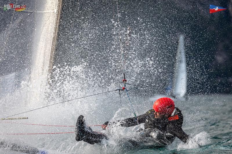 Then Matti buries the nose and goes around the forestays. This is why the sailors like to wear all the protective kit! A-Class European Championships photo copyright Gordon Upton / www.guppypix.com taken at Circolo Vela Arco and featuring the A Class Catamaran class