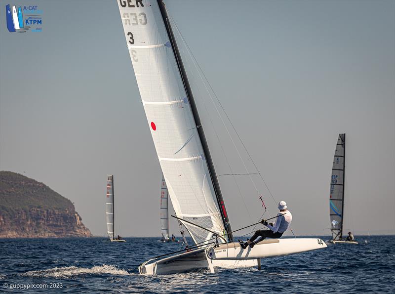 A-Cat Worlds at Toulon, France Day 1 - Popular veteran German lake sailor Matthias Dietz, GER 3, looks totally at home in these conditions, and is lying 3rd as a result photo copyright Gordon Upton / www.guppypix.com taken at Yacht Club de Toulon and featuring the A Class Catamaran class