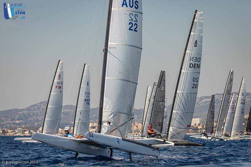 A-Cat Worlds at Toulon, France Day 2 - Joey Randal AUS 22 nails the pin on race 1 photo copyright Gordon Upton / www.guppypix.com taken at Yacht Club de Toulon and featuring the A Class Catamaran class